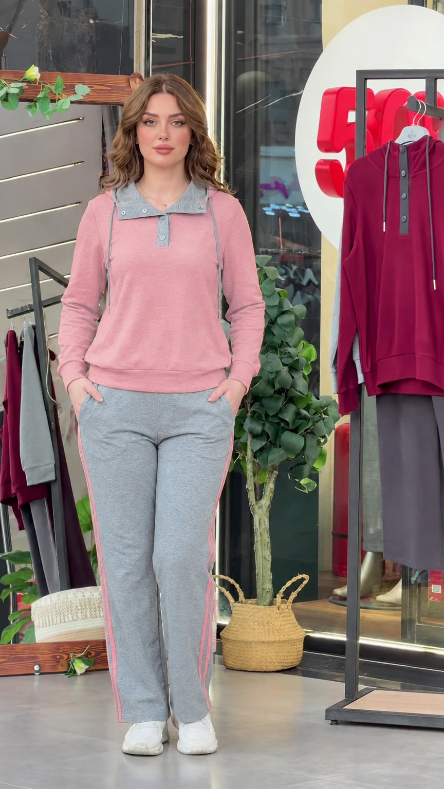 Model wearing dusty pink long sleeve top with grey collar and coordinated side-stripe sweatpants