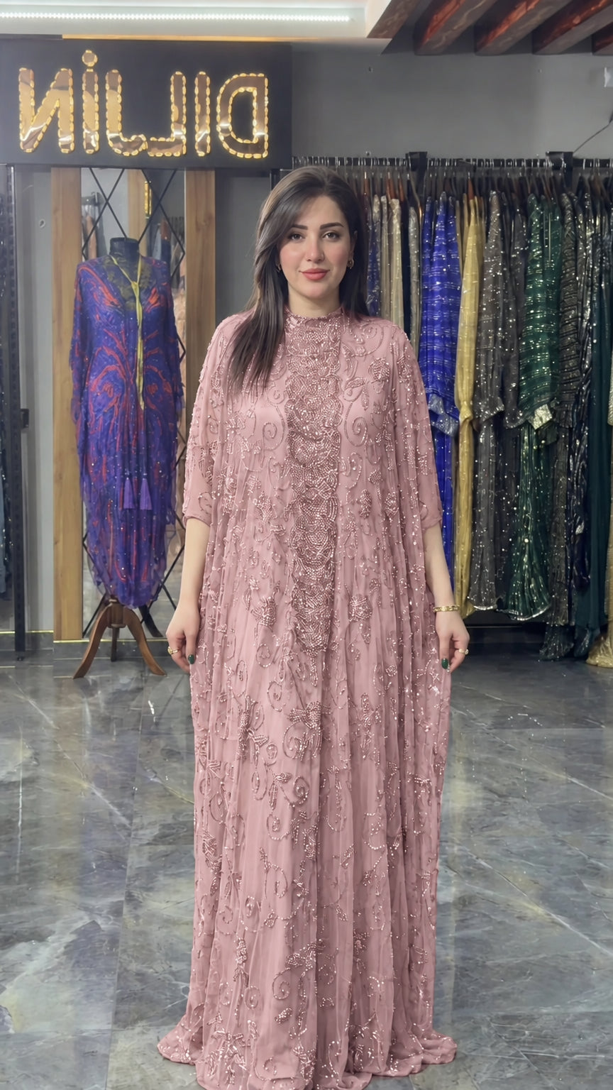 Front view of dusty pink hand-beaded cape formal maxi dress