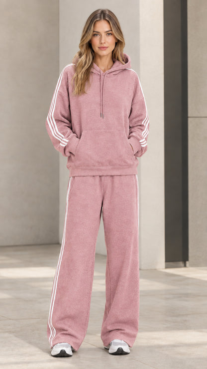 Model wearing dusty pink 2-piece striped hoodie and wide-leg sweatpants set