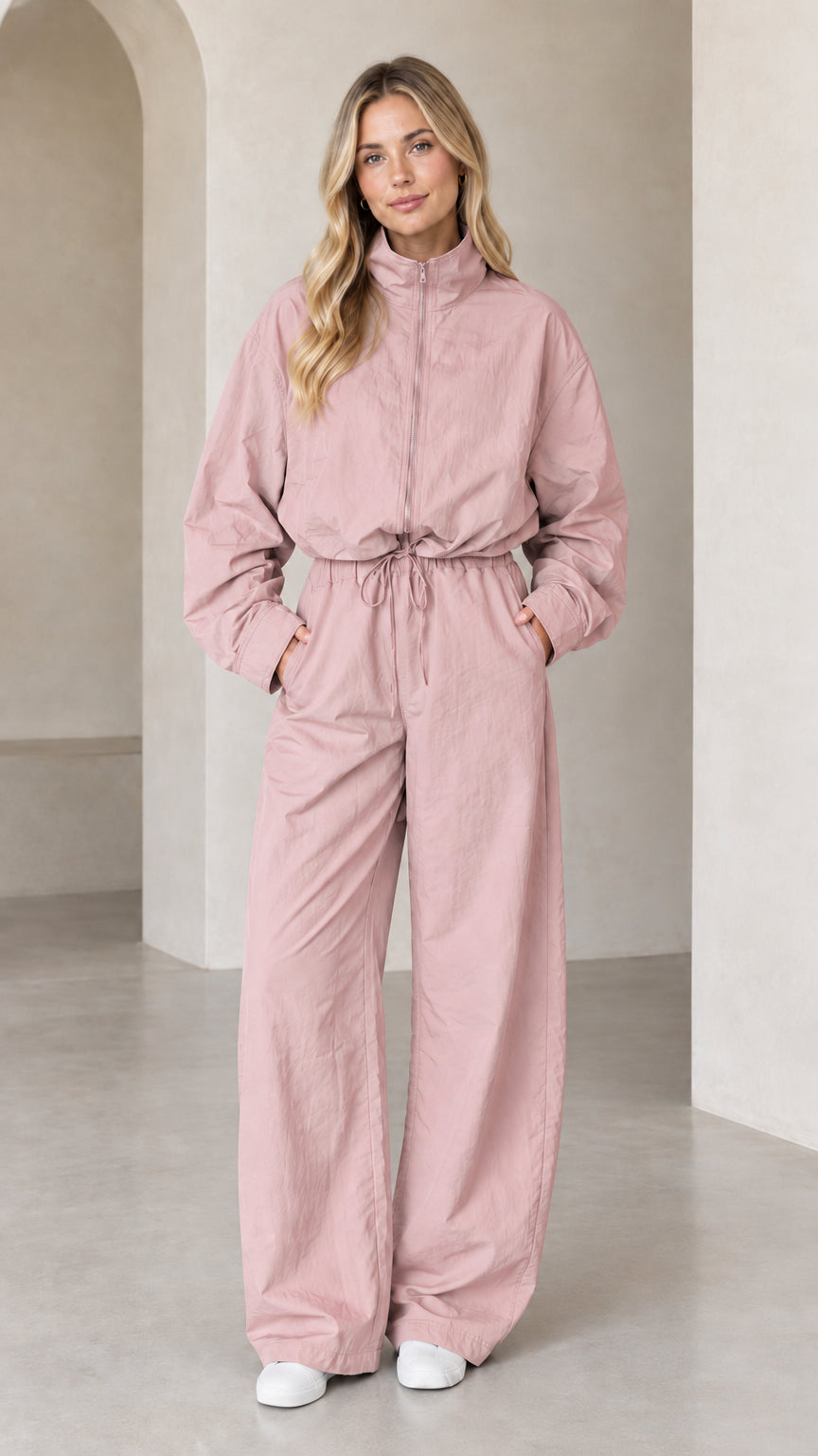 Front full-length view of woman wearing Dusty Pink zip-up wide-leg utility jumpsuit