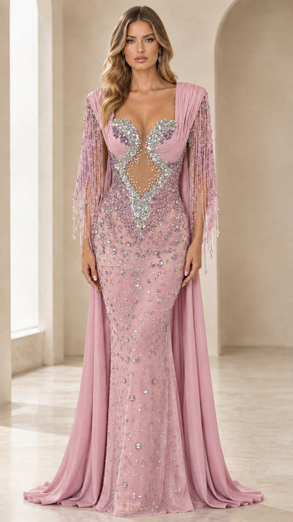 Front view of dusty pink rhinestone formal gown with illusion mesh bodice and cape