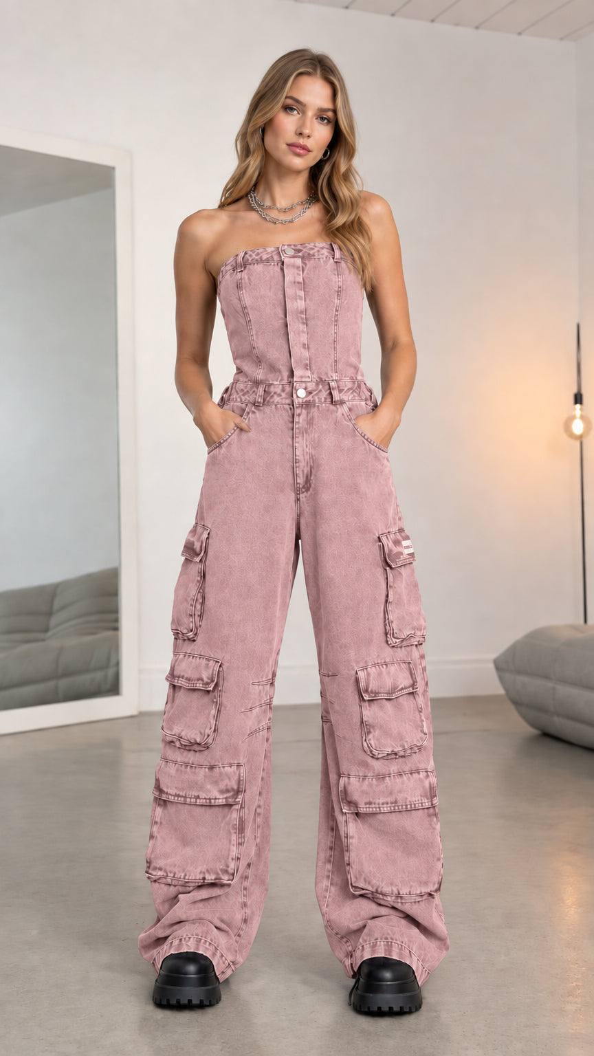 Front full-length view of model wearing dusty pink strapless cargo denim jumpsuit