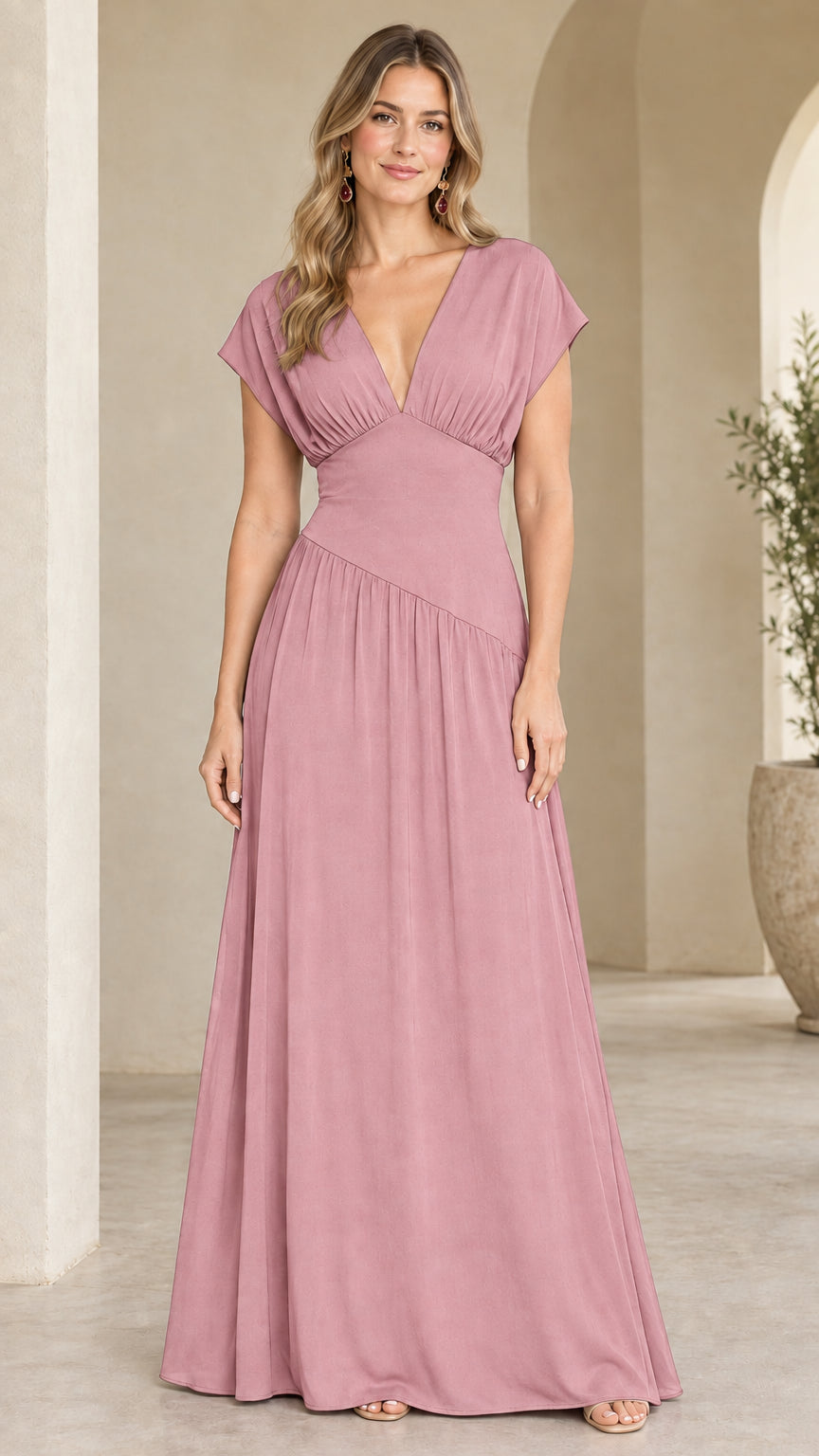 Model wearing dusty rose pleated V-neck evening maxi gown