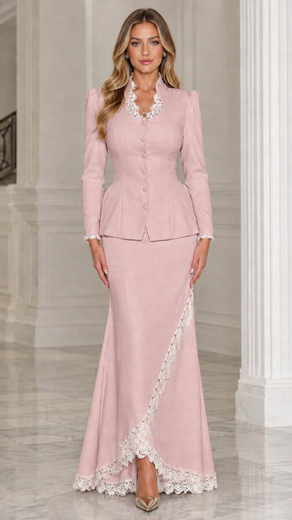 Front view of woman wearing dusty pink two-piece peplum skirt suit with lace trim