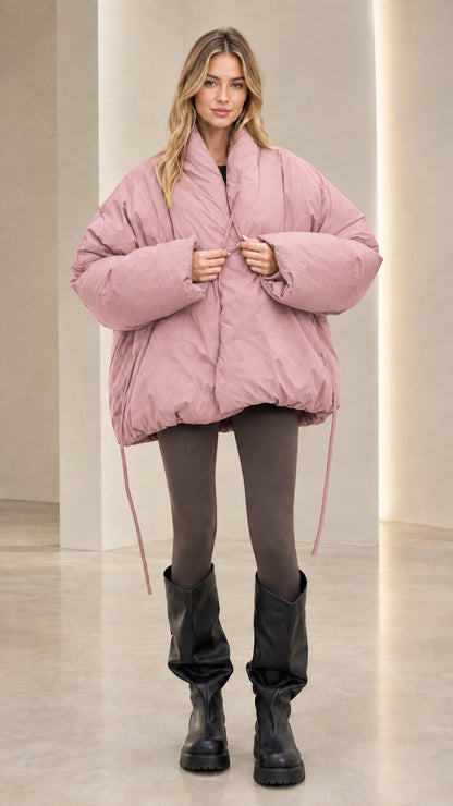 Front view of model wearing dusty pink cocoon stand collar puffer jacket