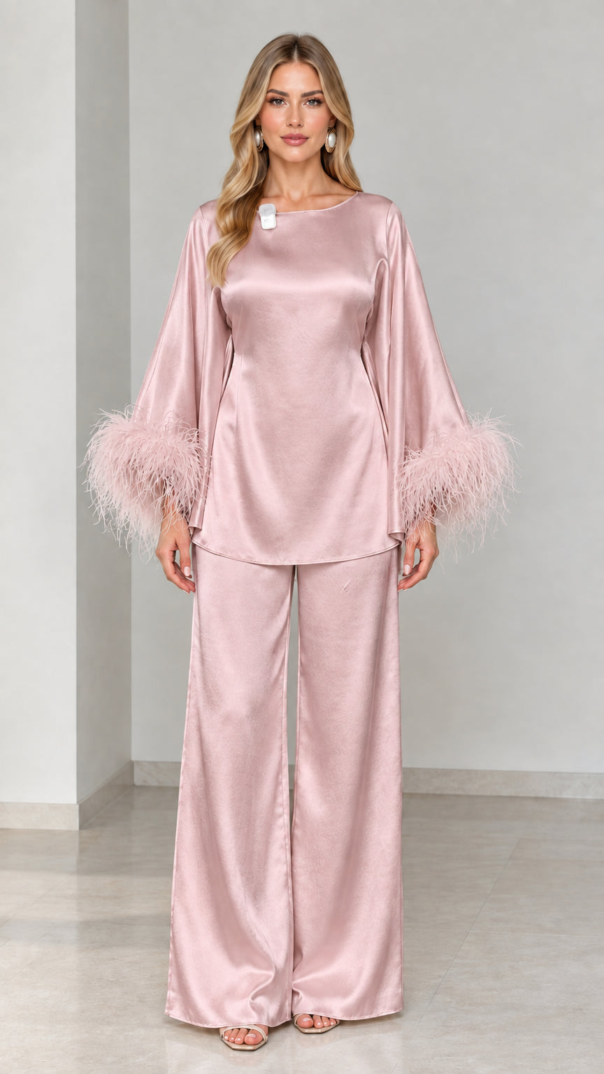 Blush pink satin two-piece tunic and wide-leg pants set with feather trim