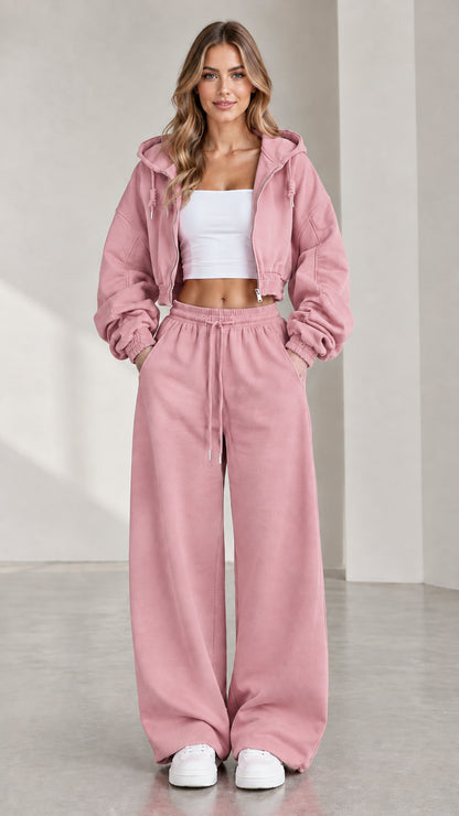 Woman wearing dusty pink cropped zip hoodie and matching wide-leg sweatpants