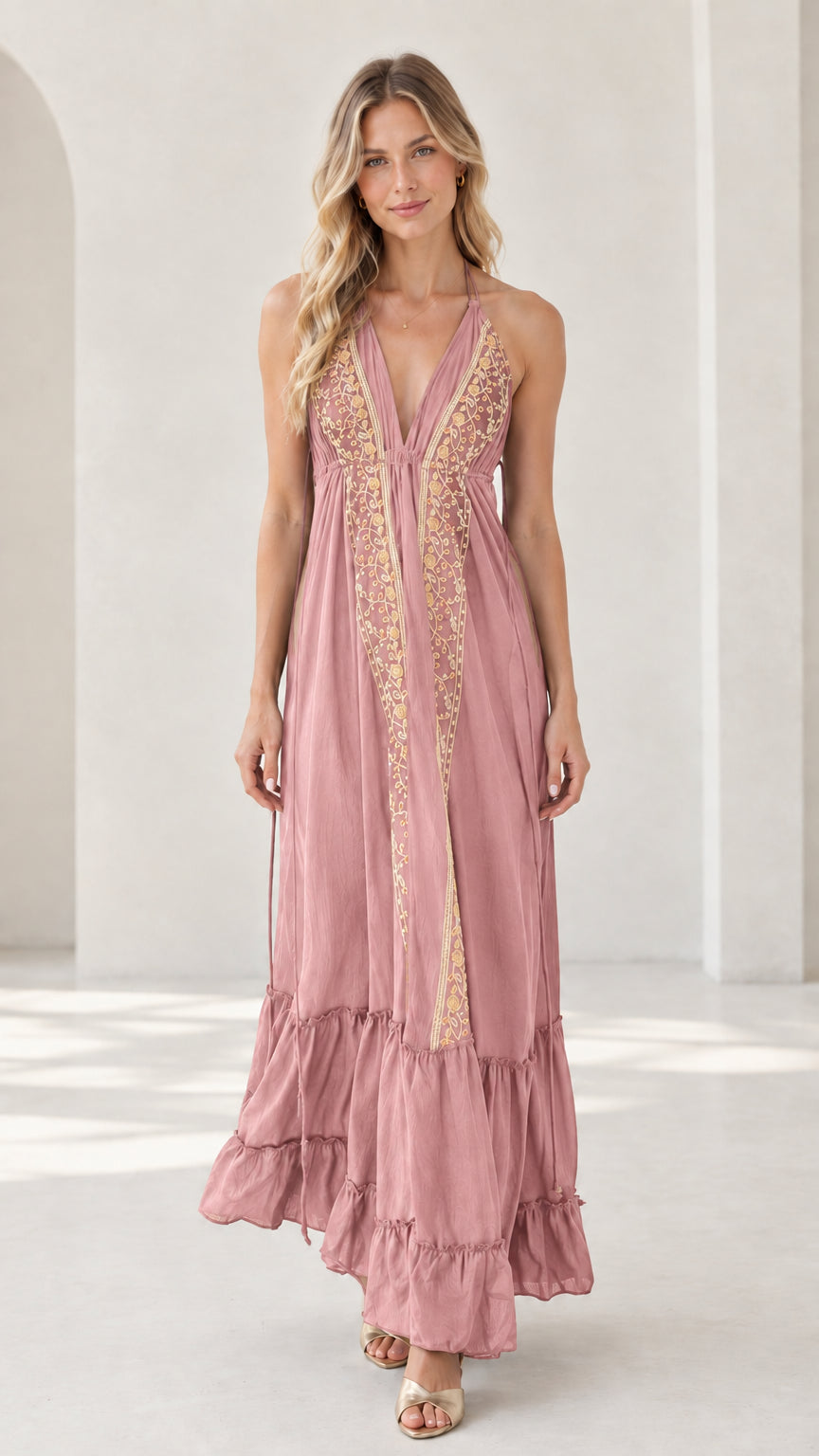 Model wearing dusty pink embroidered halter maxi dress