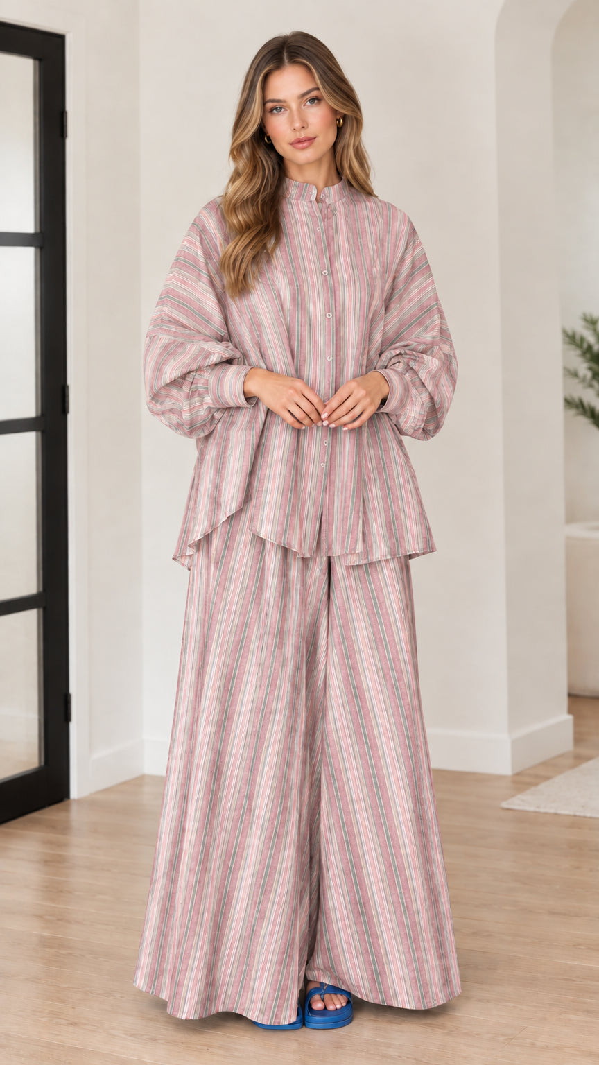 Woman wearing dusty pink vertical striped tunic top and wide leg pants set