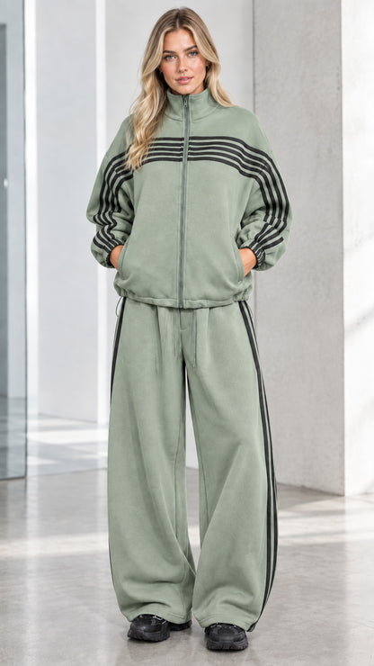 Front full view of woman wearing Sage Green striped zip-up track jacket and wide-leg sweatpants set