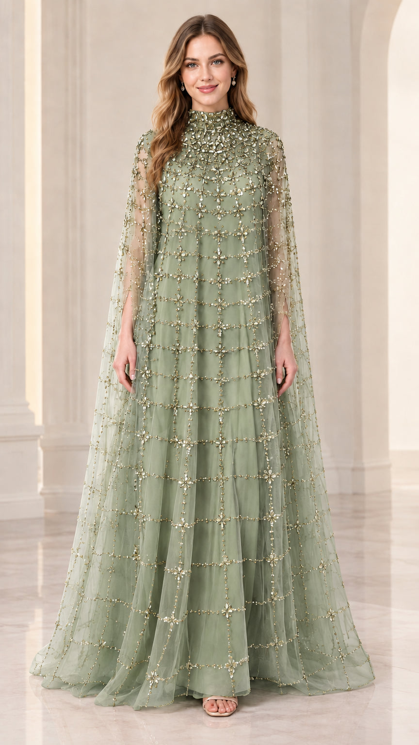 Front full view of woman wearing sage green beaded cape evening gown