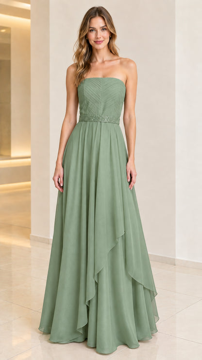 Front view of woman wearing sage green strapless pleated evening gown