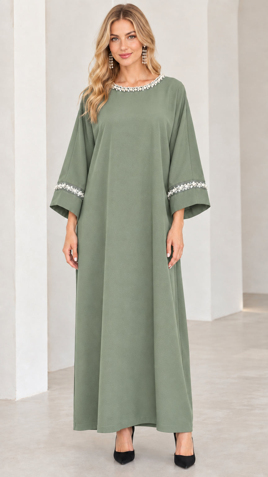 Front view of woman wearing sage green pearl-embellished modest maxi dress