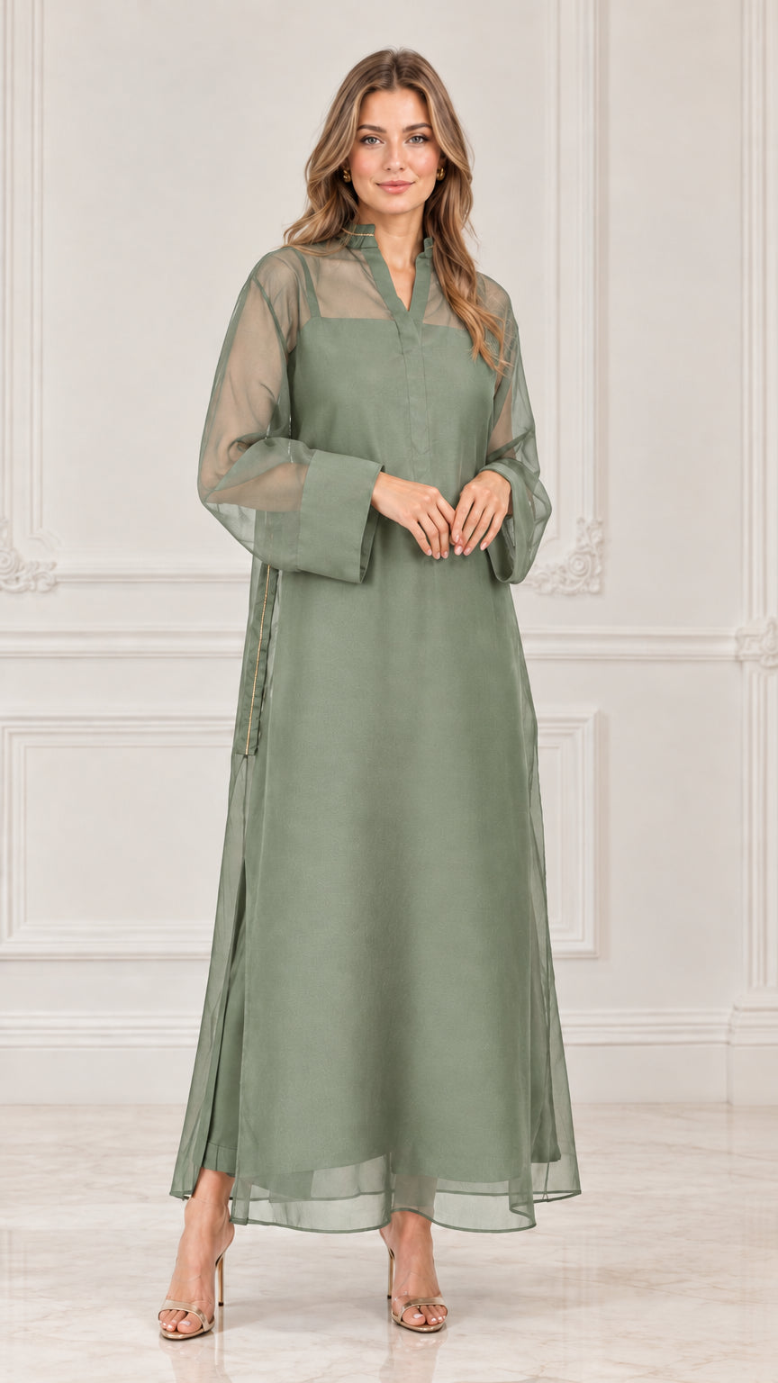 Model wearing sage green sheer overlay long sleeve maxi dress