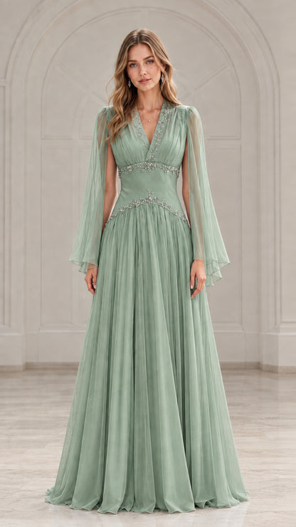 Front view of model wearing a sage green beaded V-neck evening gown with cape sleeves