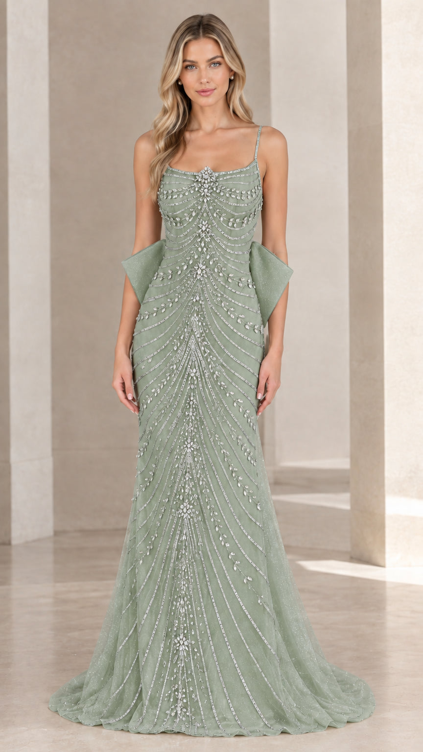Front view of sage green beaded spaghetti strap formal gown with back bow accent