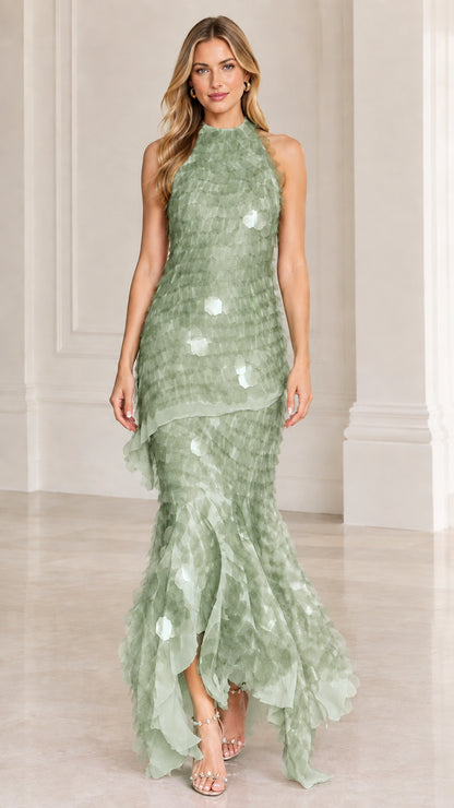 Model wearing sage green textured backless mermaid formal dress