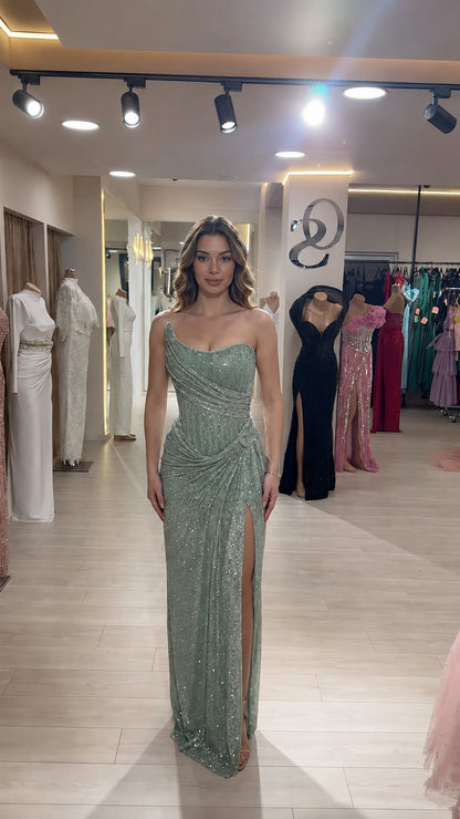 Model wearing sage green one-shoulder sequin formal maxi gown