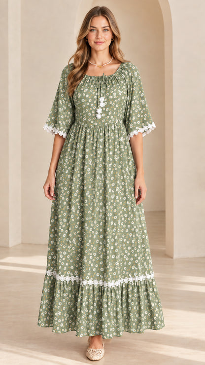 Front view of model wearing sage green floral boho tiered maxi dress
