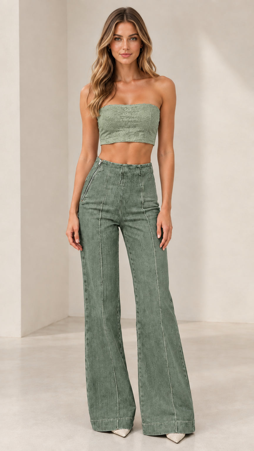 Model wearing Sage Green high-rise flare jeans paired with green top