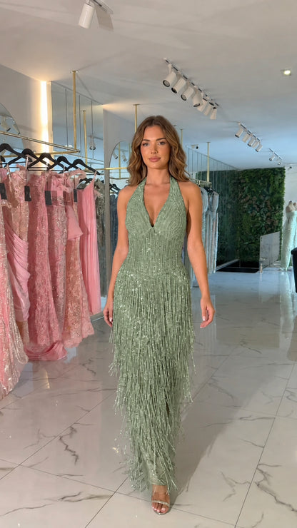Front view of sage green halter beaded fringe evening maxi dress