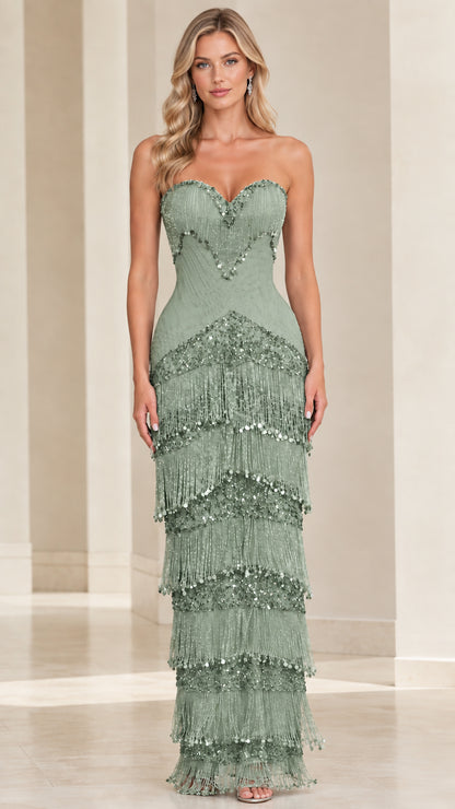 Front view of model wearing sage green strapless sweetheart tiered fringe evening gown