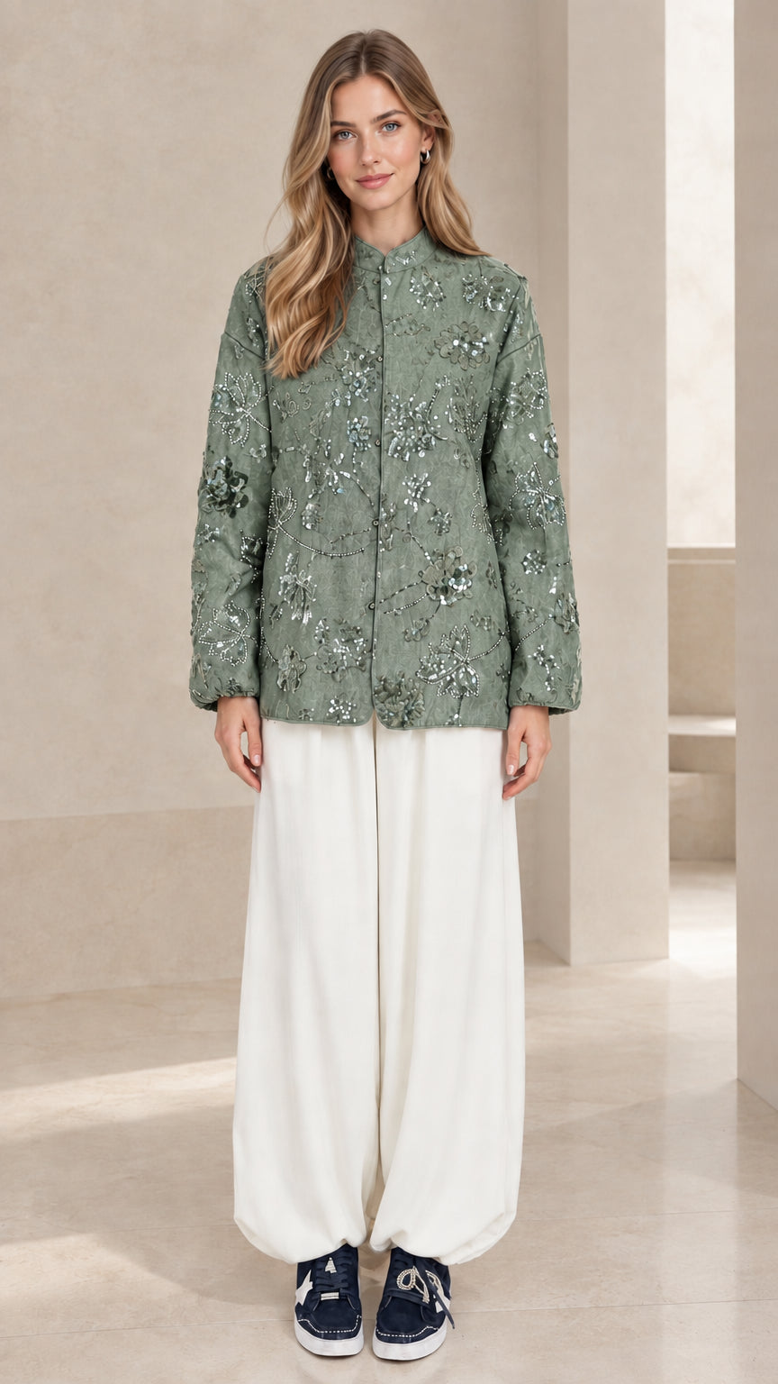 Full front view of sage green floral sequin embroidered long sleeve top