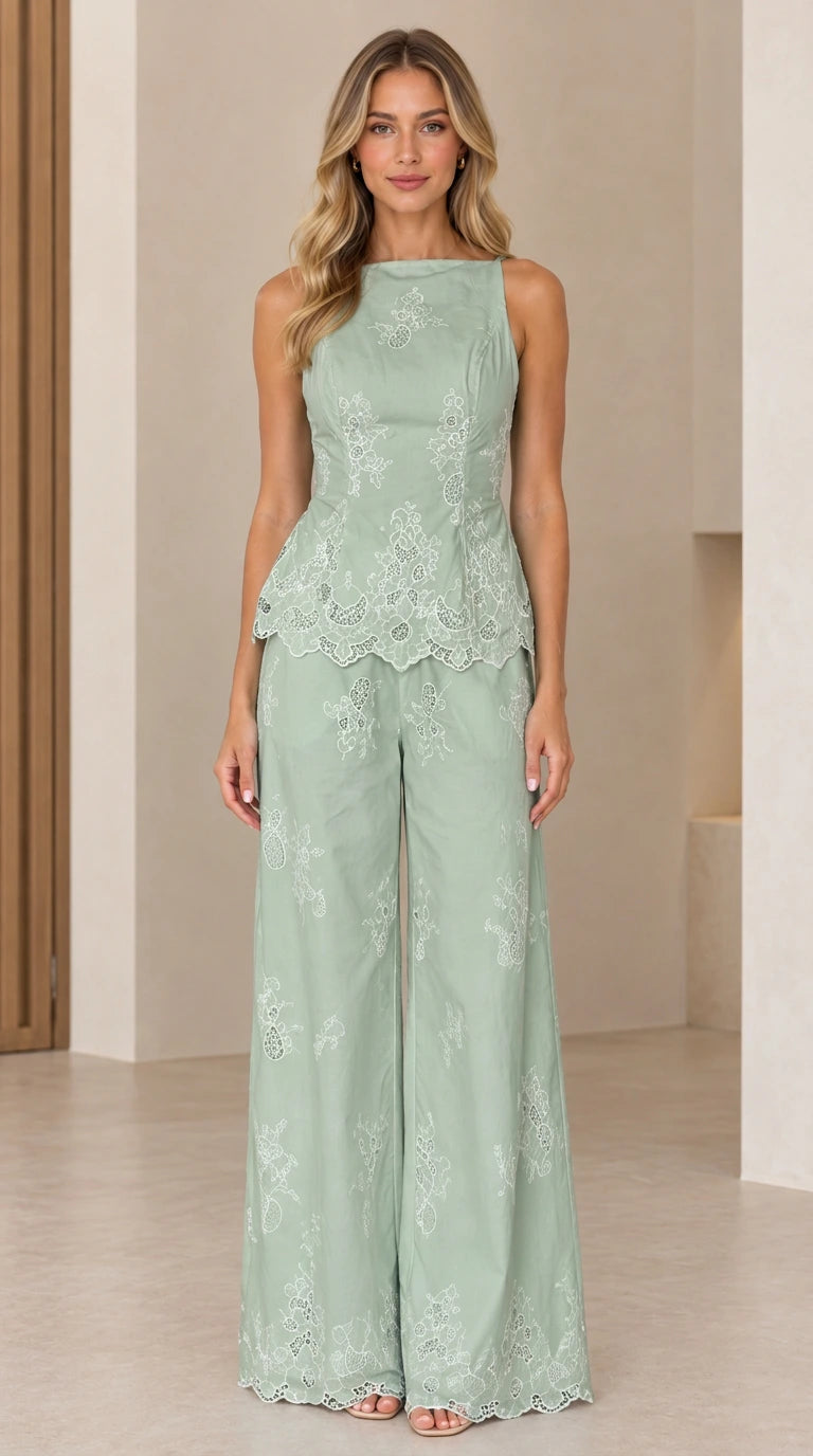 Full length view of model wearing sage green embroidered peplum and palazzo pant set