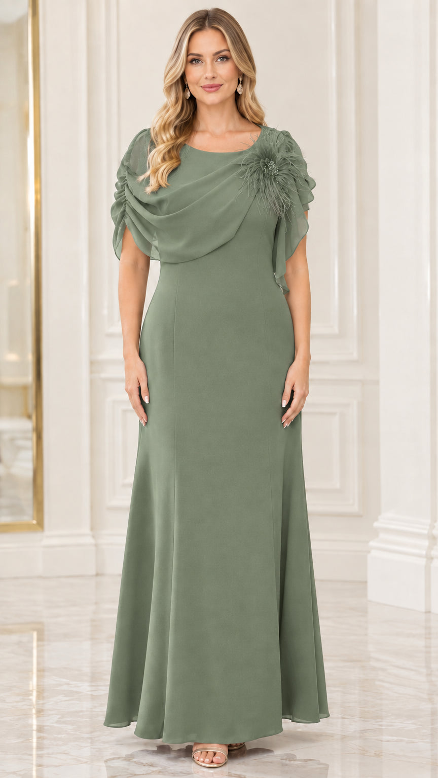 Model wearing sage green draped chiffon evening gown with shoulder flower