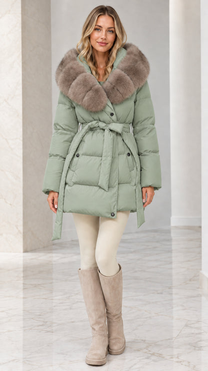 Model wearing Sage Green belted quilted puffer coat with plush faux fur collar