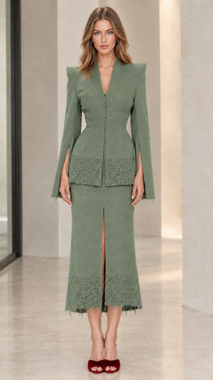 Front view of sage green tailored two-piece skirt suit with lace trim