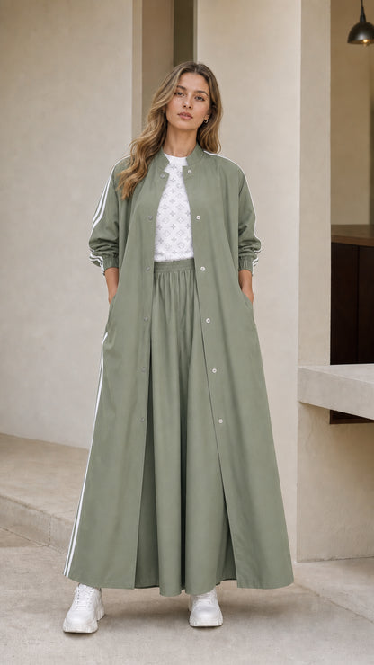 Woman wearing sage green sporty maxi duster coat and wide leg pants set