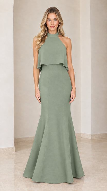 Model wearing the sage green halter neck mermaid floor-length dress