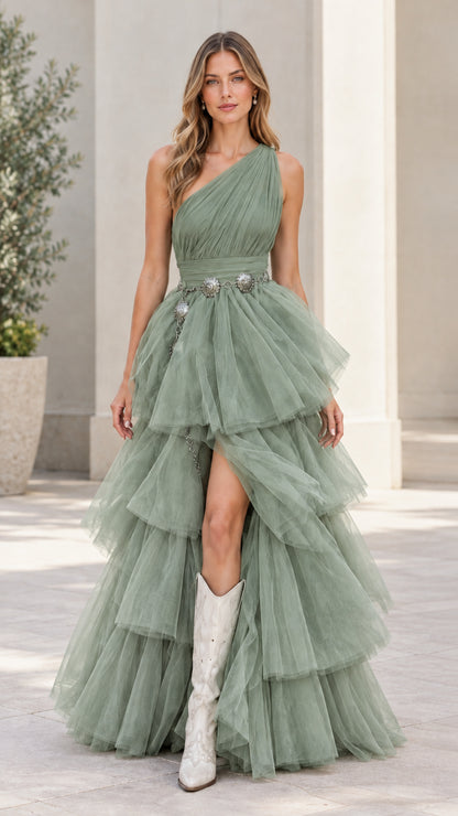 Model wearing sage green one-shoulder tiered tulle maxi dress with slit