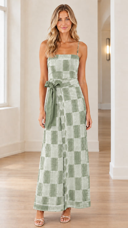 Front view of woman wearing sage green checkered spaghetti strap wide-leg jumpsuit