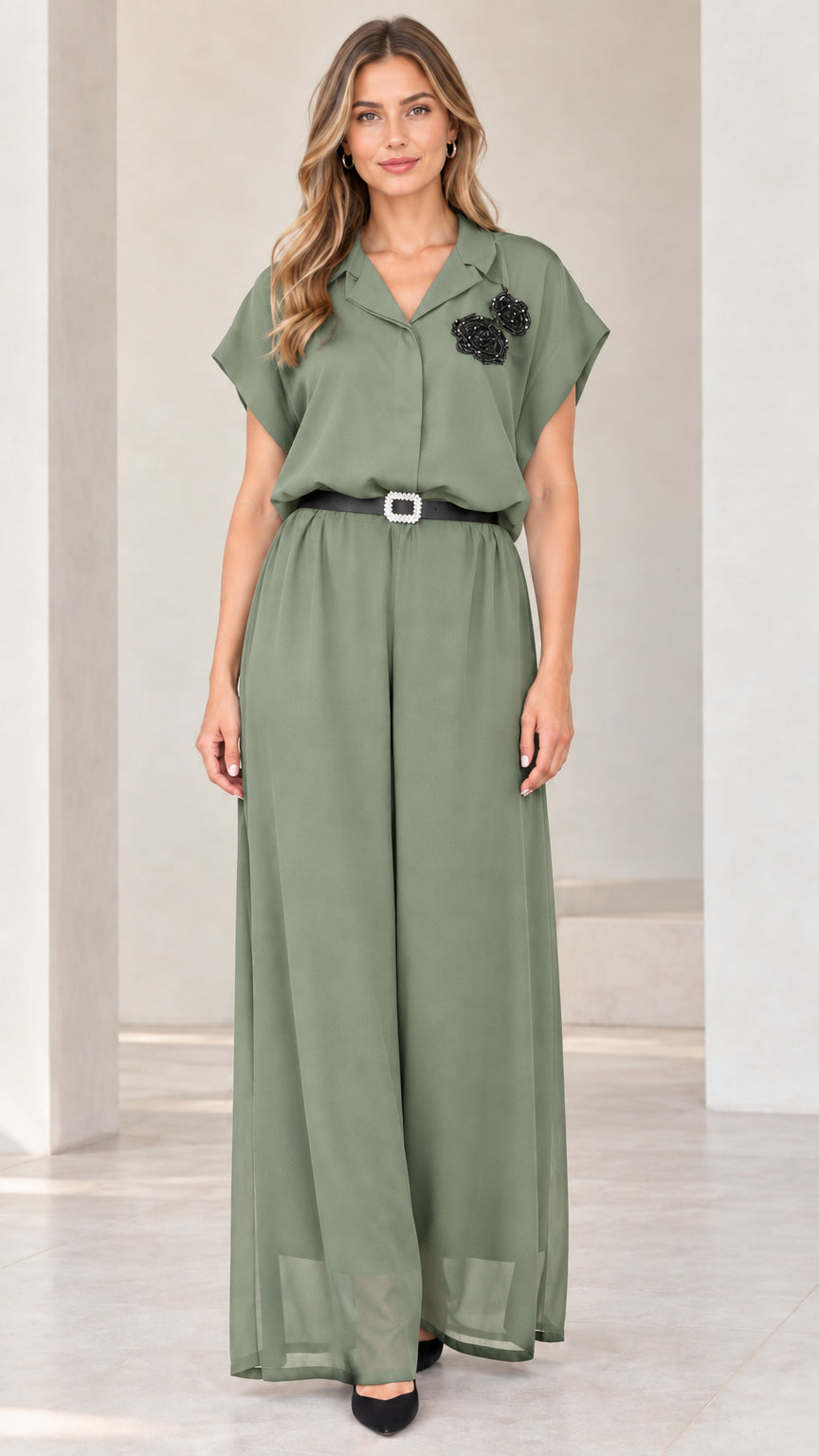 Front view of woman wearing sage green short sleeve wide-leg evening jumpsuit