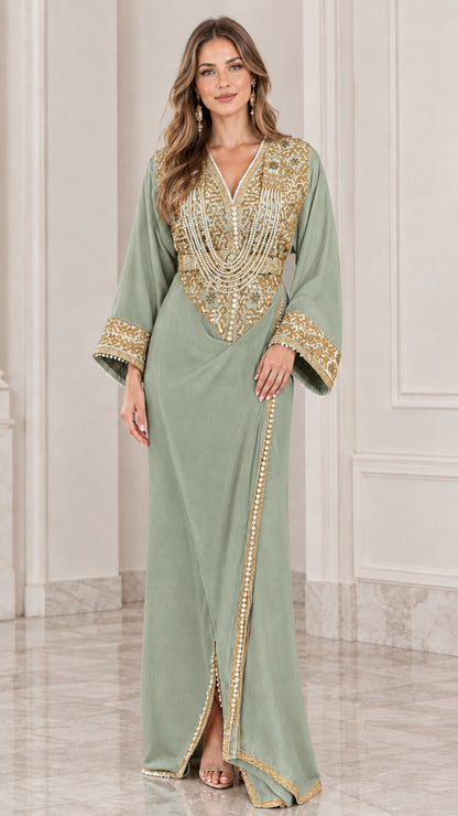 Front view of model wearing sage green kaftan maxi dress with gold embroidery