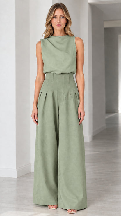 Full-length view of solid sage green sleeveless wide-leg pleated jumpsuit