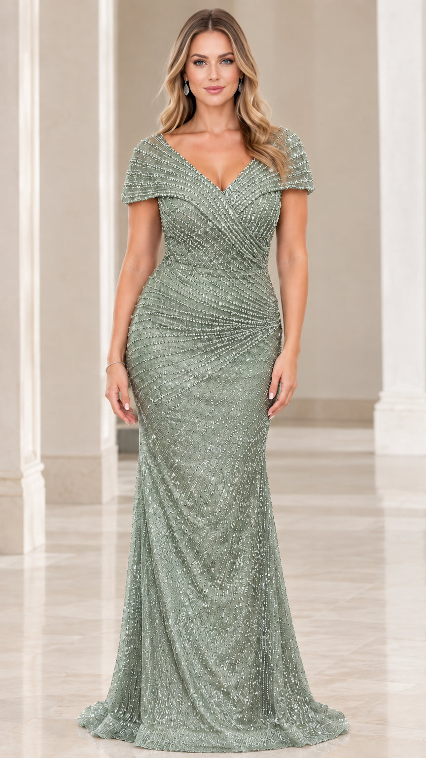 Front view of model wearing the sage green embellished formal gown