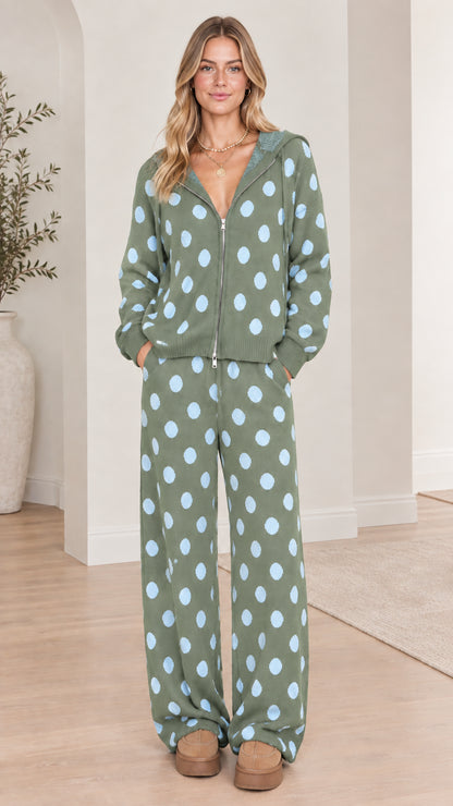 Full front view of model wearing sage green polka dot knit zip-up hoodie and pants set