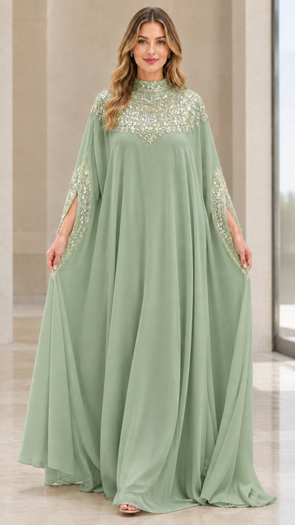 Model wearing sage green beaded cape sleeve kaftan evening gown