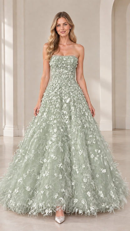 Model wearing strapless sage green floral applique formal dress