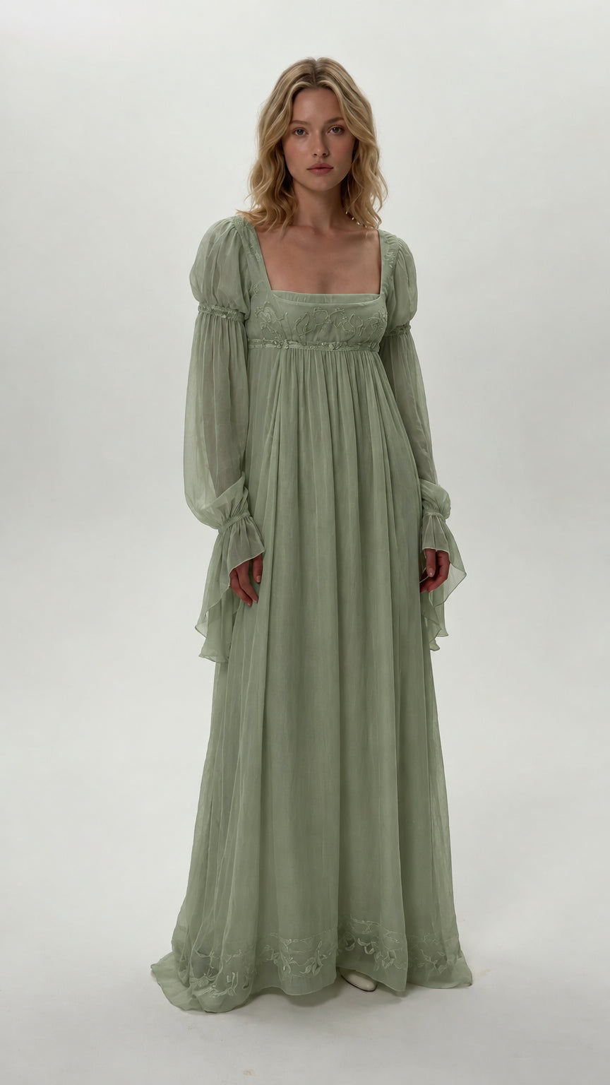 Front view of model wearing sage green empire waist chiffon maxi dress