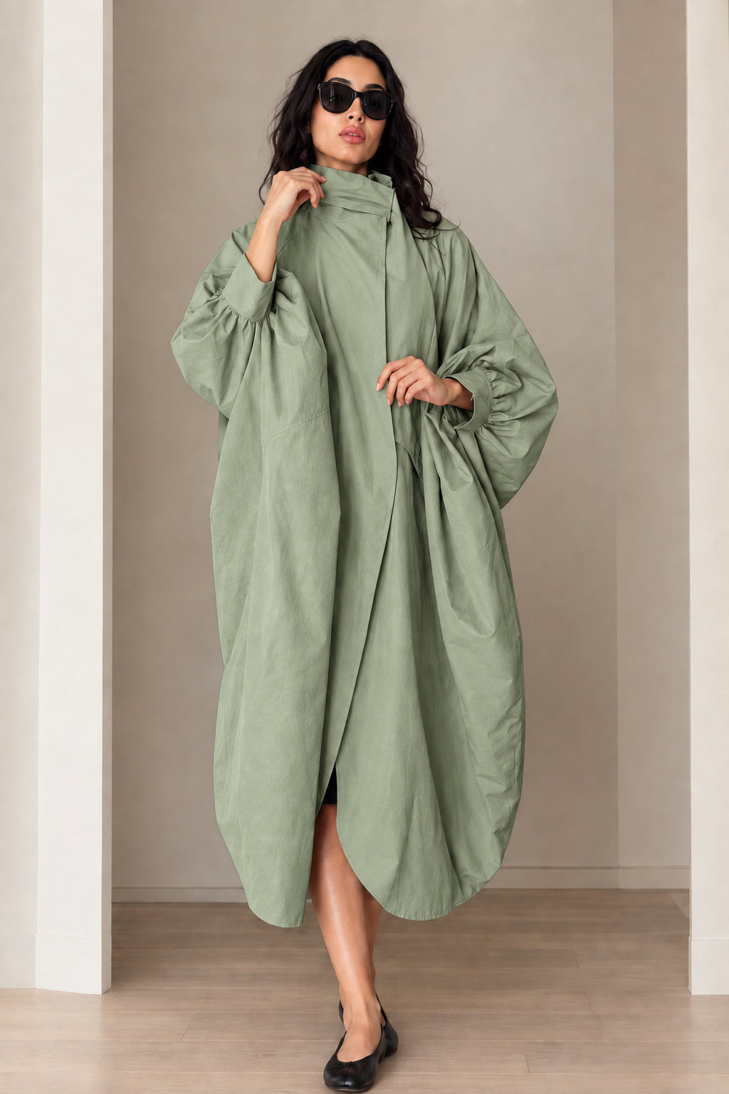 Model wearing sage green oversized cocoon duster coat