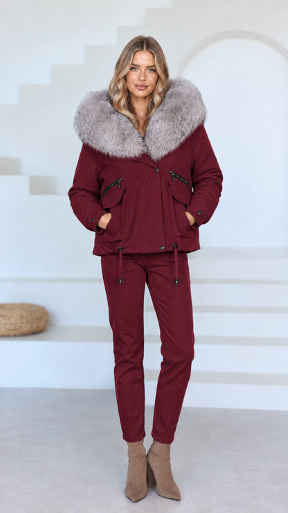 Front view of model wearing burgundy red faux fur hooded jacket and matching burgundy pants