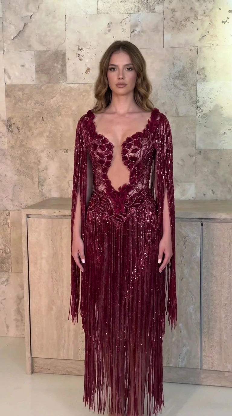 Front view of model wearing burgundy wine red beaded fringe evening gown