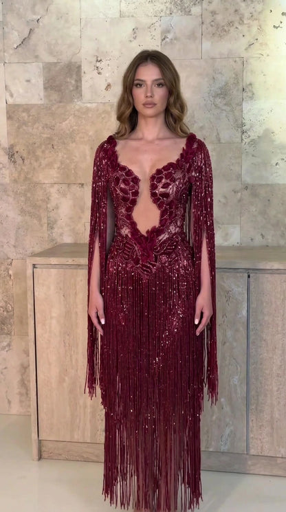Front view of model wearing burgundy wine red beaded fringe evening gown