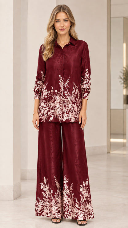 Front full view of women's floral satin shirt and wide-leg pants set in burgundy