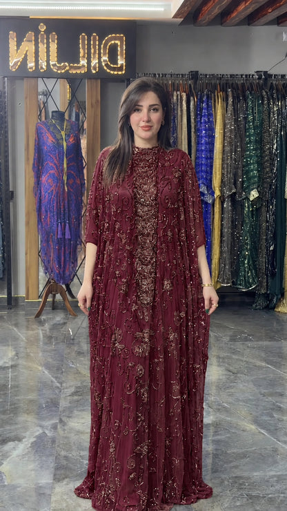 Front view of burgundy wine hand-beaded cape formal maxi dress
