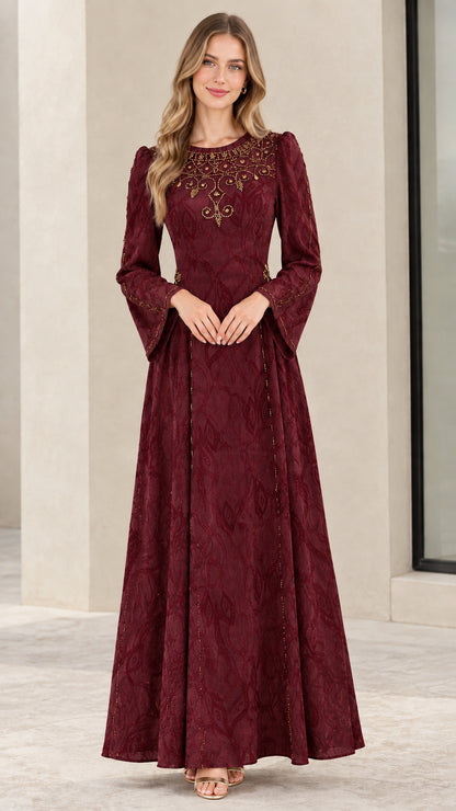 Model wearing burgundy red embellished jacquard evening dress